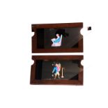 Mahogany-mounted Magic Lantern Slides: comic scene double slipper slides, hand painted, 175 x 102mm,