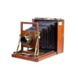 A Henry Crouch Mahogany Field Camera, with rear folding bed, 4½x6¼”, with unmarked f/8 brass lens,