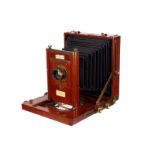 A Rochester Optical Co. Carlton Mahogany Field Camera, 5x7”, with The Scientific Lens Co. Extra W.