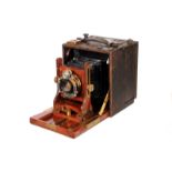 A J. H. Dallmeyer Morocco leather-covered Mahogany Hand Camera, with falling front bed, 3x4”, with