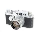 A Leica IIIg Rangefinder Camera, 1957, chrome, serial no. 868164, with Leitz Summarit f/1.5 50mm