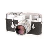 A Leica M3 Rangefinder Camera, 1959, chrome, serial no. 974228, with Leitz Summicron f/2 50mm