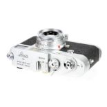 A Leica M1 Rangefinder Camera, 1959, chrome, serial no. 966520, with Leitz Elmar f/2.8 50mm lens,