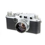 A Leica IIIf Red Dial Rangefinder Camera, 1953, chrome, serial no. 650561, with Leitz Summitar f/2