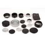Various Leica Accessories: quantity of various Leica accessories including, lens hoods, caps, and