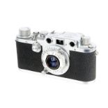 A Leica IIIc Rangefinder Camera, 1948/50, chrome, sharkskin, serial no. 499450, with Leitz Elmar f/