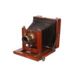 A C. C. Vevers Mahogany Field Camera, 4½x6¼, with C. C. Vevers 7x5” Waterhouse-stop brass lens,