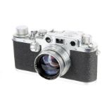 A Leica IIIc Rangefinder Camera, 1948/50, chrome, sharkskin, serial no. 477643, with Leitz