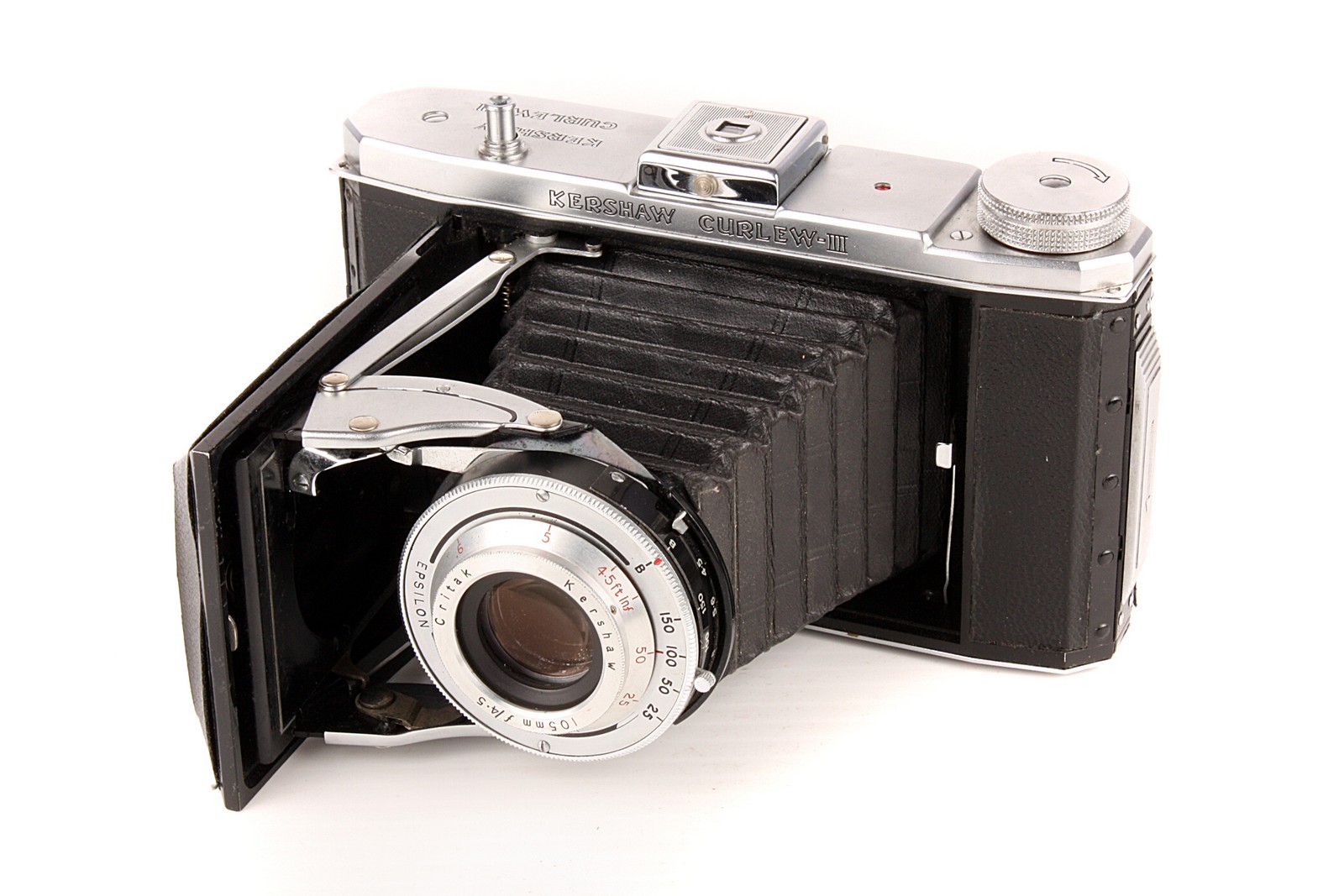 A Kershaw Curlew III Camera, chrome, serial no. 3/6460, with Critak f/4.5 105mm lens, body, G,