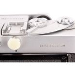 A Leica M2 Rangefinder Camera, chrome, serial no. 1114420, with Leitz Summicron f/2 50mm lens,