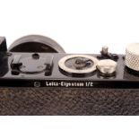 A Leica I Model B Rim Set Camera, black, serial no. 34716, with Leitz Elmar f/3.5 50mm lens, in