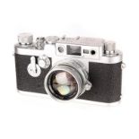 A Leica IIIg Rangefinder Camera, 1957, chrome, serial no. 906805, with Leitz Summicron f/2 50mm