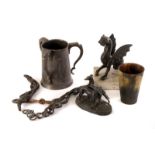 A group of four pewter meat covers, together with a selection of other pewter and metal ware