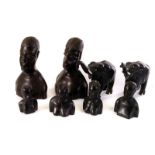 A selection of early 20th century African Tribal art, to include carved busts and two elephants (