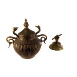 A Middle Eastern brass pot and cover, the twin handled design with etched swag decoration,