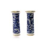 A good pair of Chinese blue and white vases, having dragons amongst cloud decoration, both with