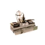 A George V silver and glass ink and stamp stand, having two hinged lids with stamp fronts and