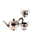 A large collection of silver plated items, including flatware, a cake stand, candelabra, jugs and