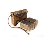 A 19th century Quran, in leather carry case, with woven decoration