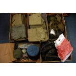 A large collection of mid 20th century military shirts, all in various different greens, together