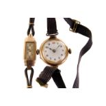 A 9ct gold vintage lady's wristwatch, together with another example, both on black material