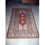An Eastern knotted carpet, with central geometric medallion, surrounded by a multi-border, approx