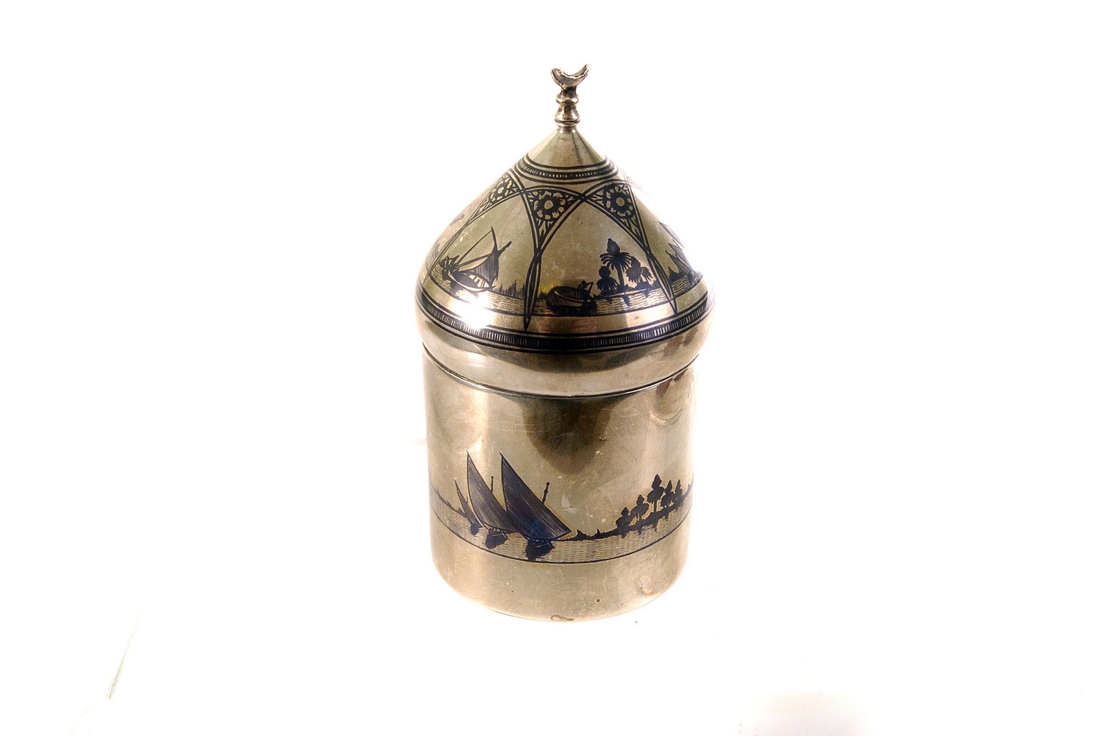 A Middle Eastern silver Neillo work box, having various land and sea scape decoration, the domed lid