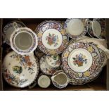 A collection of Wedgwood Poterat ceramics, including cups and saucers, graduated plates, a meat