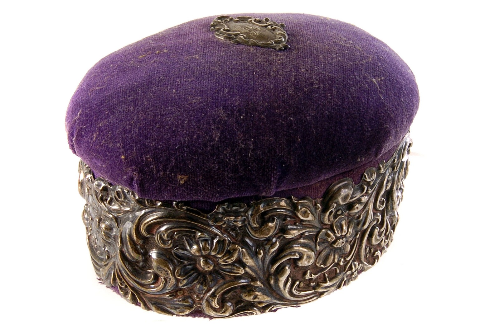 An Edward VII silver repousse jewellery casket, having swag design to body, the purple felt