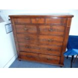 A Victorian mahogany tall boy chest of drawers, in flame style mahogany with some strung details,