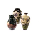 A group of three Moorcroft vases, all of different form and decoration, including Ashwood Hepatica