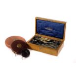 An Edwardian draughtsman's drawing set, in case, together with a selection of measures