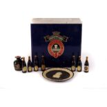 A Wedgwood Guinness 225th Anniversary plate, together with a Guinness presentation pack, to