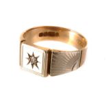 A 9ct gold and gem set gents signet ring, the round cut gem in a star shaped setting, size approx
