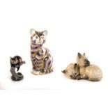 A Royal Crown Derby pussy cat figure and stopper, together with a Beswick Siamese cat figure, a