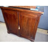 A rosewood chiffonier base, having strung decoration, the two doors open to reveal two internal
