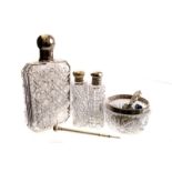 A silver sterling marked cut glass hip flask, together with other cut glass bottles with silver