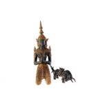 A metal figure of a praying Asian God, having gilt painted dress and headdress, together with a