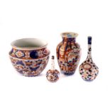 A collection of late 19th century Asian ceramics, including a pair of blue and white chargers, an