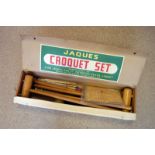 A Jacques of London Croquet set, comprising mallets, balls, hoops, a peg and instruction manual,