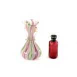 A small Murano glass vase, having green and pink design, with white cotton twist decoration,