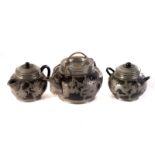 A Chinese pewter mounted three piece tea set, having dragon design the brass eyes (3)