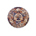 A large Japanese Imari patterned porcelain charger, approx 40cm diameter