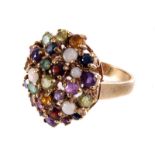 A 9ct gold and gem set ring, having multiple gem stone, comprising, garnet, sapphires, opals and