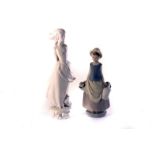 A Lladro bisque figure of a milk maid, 4939, together with another Lladro blanc-de-chine Bisque