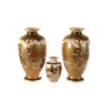 A pair of Satsuma baluster vases, having oriental lake and house scene, together with a smaller