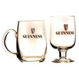 A selection of Guinness drinking glasses, including smaller and larger jugs, plus various others (