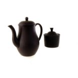 A Wedgwood black basalt six setting coffee set, including six cups and saucers, coffee pot, sugar