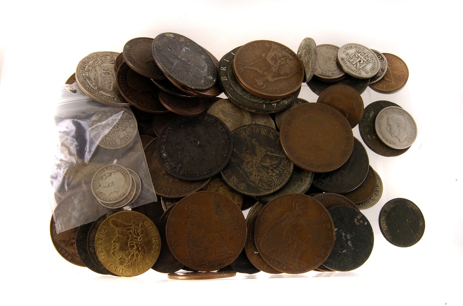 A collection of various coins, including Charles II, William and Mary, George II and III and later