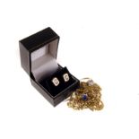 A 9ct gold paste set solitaire, together with a pair of yellow metal and gem set earrings and